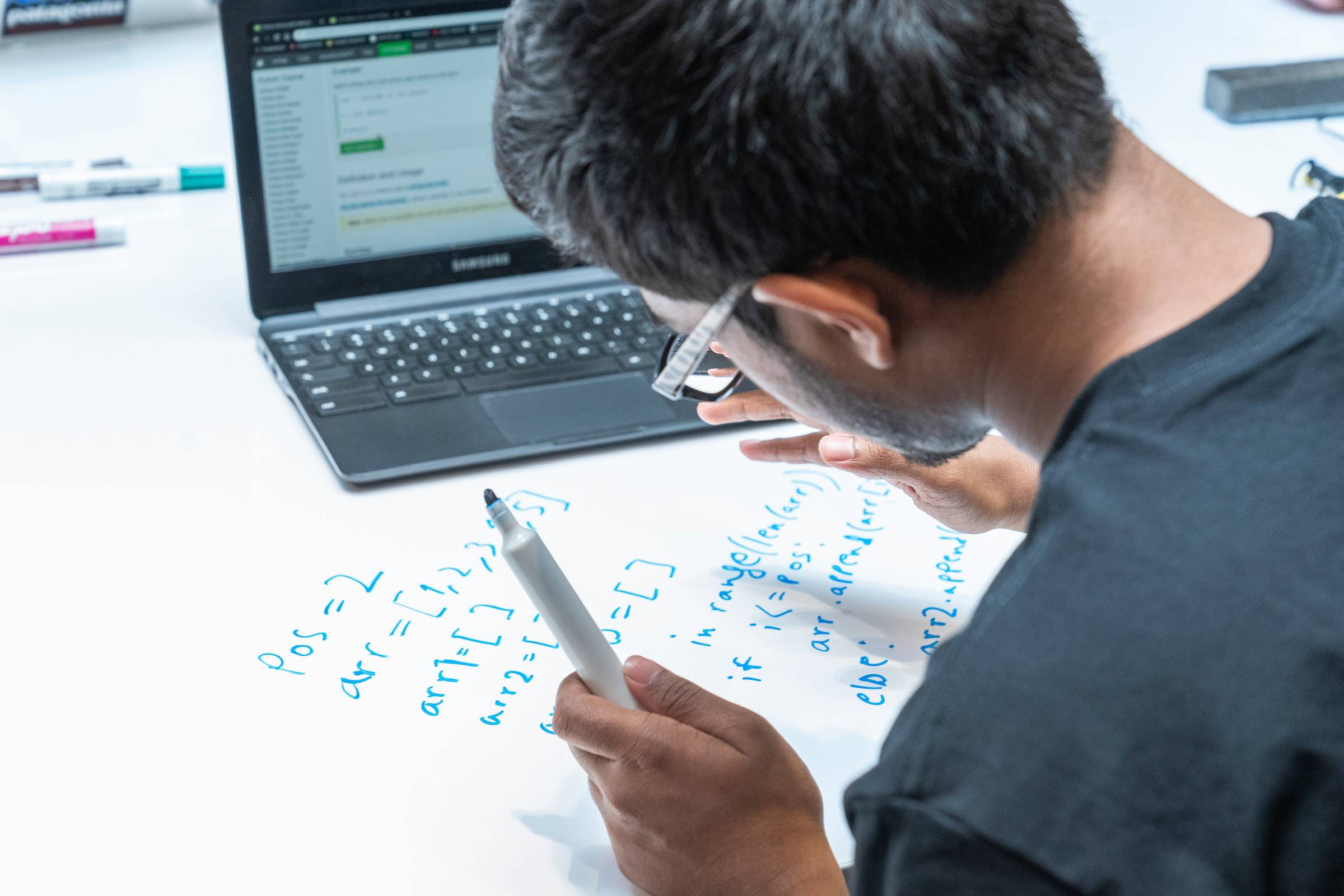 Student coding in Benton Hall