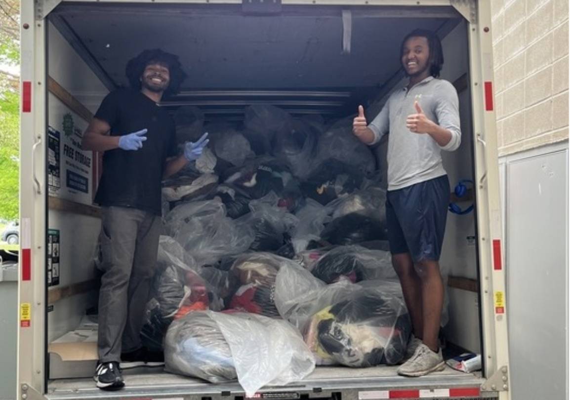 Students loading items into a truck for spring salvage 2024.