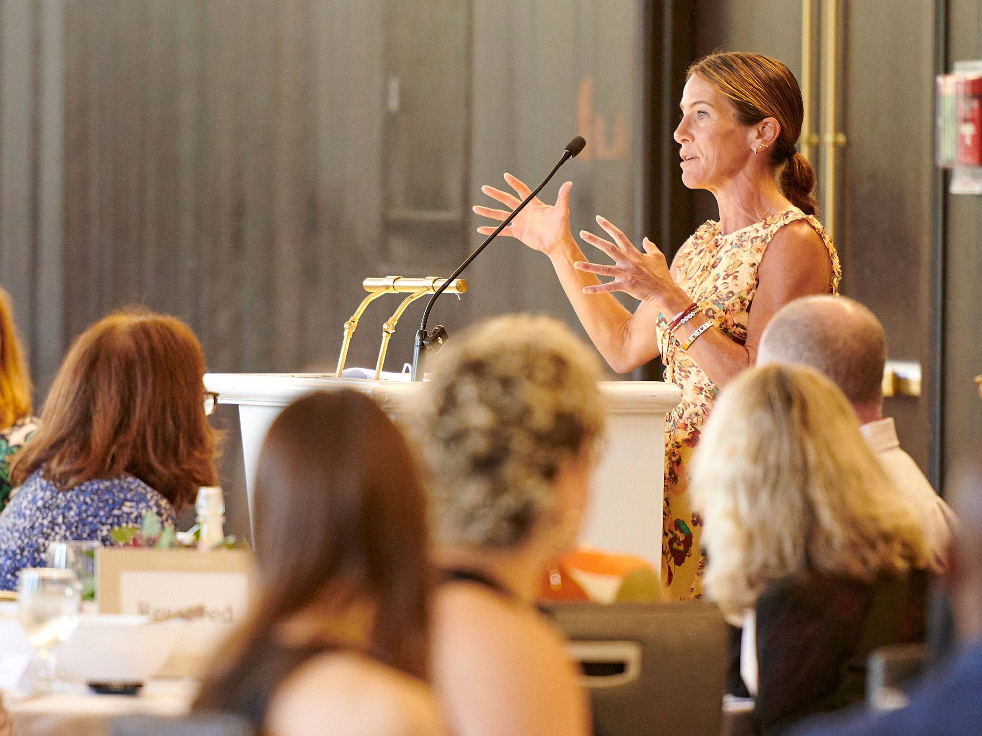 Mandy DiMarzo ʼ02 speaks to luncheon attendees